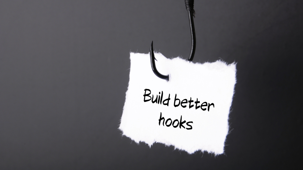 A picture of a fishing hook catching a piece of paper. It says build better hooks.